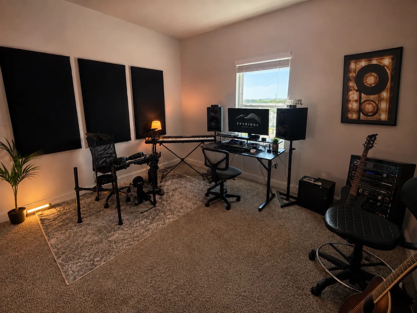 SkyRidge Studios recording room by daylight, with electronic drums, keys, and acoustic paneling
