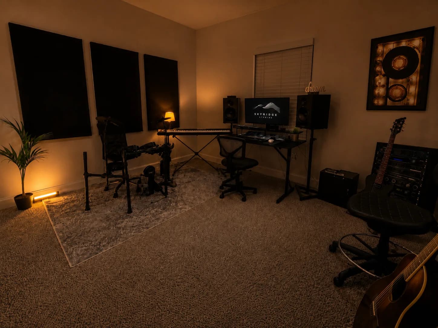 SkyRidge Studios recording room at night, warmly lit with instruments and monitors